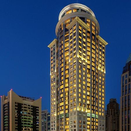 Dusit Hotel & Suites - Доха Экстерьер фото The hotel at night